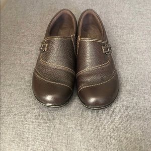 Brown slide on clogs.